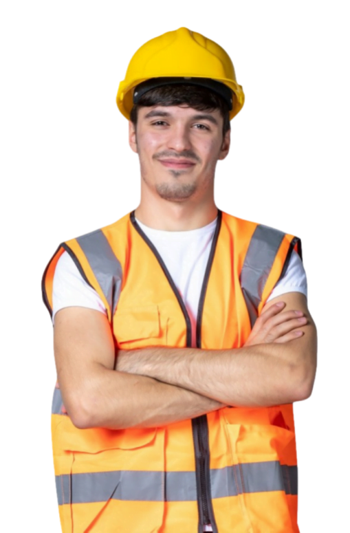 A person wearing a yellow hard hat and an orange reflective safety vest stands with arms crossed, smiling after completing a roof inspection.